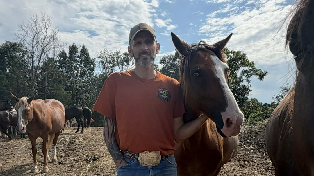 Adam Watson standing with a horse