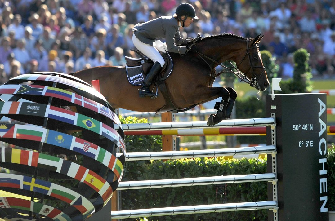 Showjumping clearing Aachen globe jump in equestrian arena